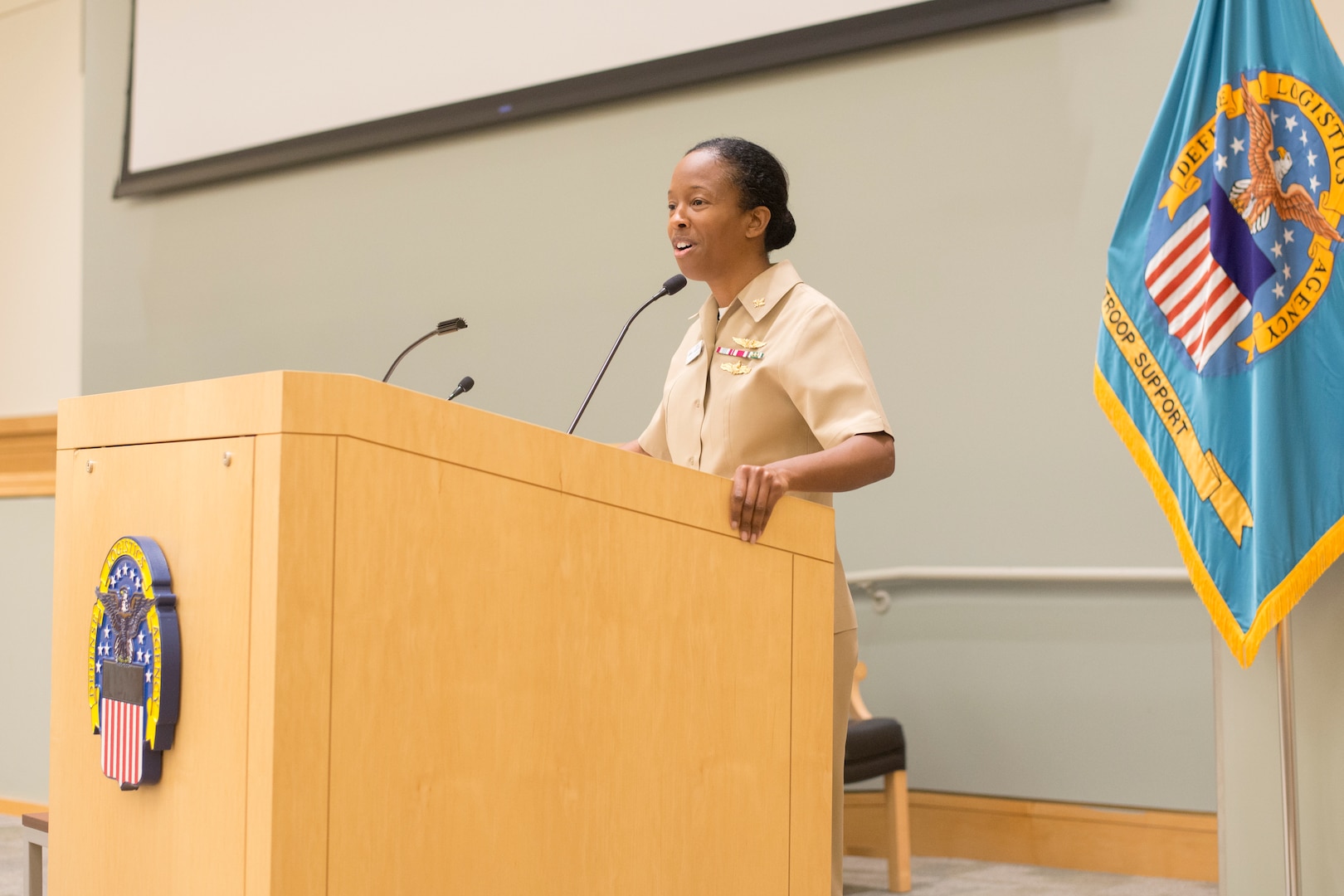 Navy Capt. Kerri Yarbrough, Naval Supply Systems Command Weapon Systems Support Aviation deputy commander, speaks to the audience during a National American Indian Heritage Month program at DLA Troop Support, Dec. 11, 2018 in Philadelphia.