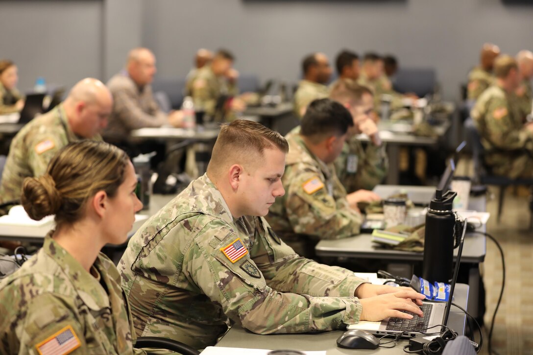 Army 2nd Lt. Kat Wilson and 1st Lt. DeWayne Cox 261st, Multi-Functional Medical Battalion, Fort Brag, N.C., participate in a Joint Operations Center Training Course at Fort Eustis, Dec., 11-13, 2018. The three-day course educated and prepared the Defense CBRN Response Force (DCRF) members of JTF-CS for a catastrophic Chemical, Biological, Radiological and Nuclear (CBRN) event. When directed, JTF-CS is ready to respond in 24 hours to provide command and control of 5,200 federal military forces located at more than 30 locations throughout the nation in support of civil authority response operations to save lives, prevent further injury and provide critical support to enable community recovery. (DoD photo by U.S. Air Force Tech. Sgt. Michael Campbell/ Released)
