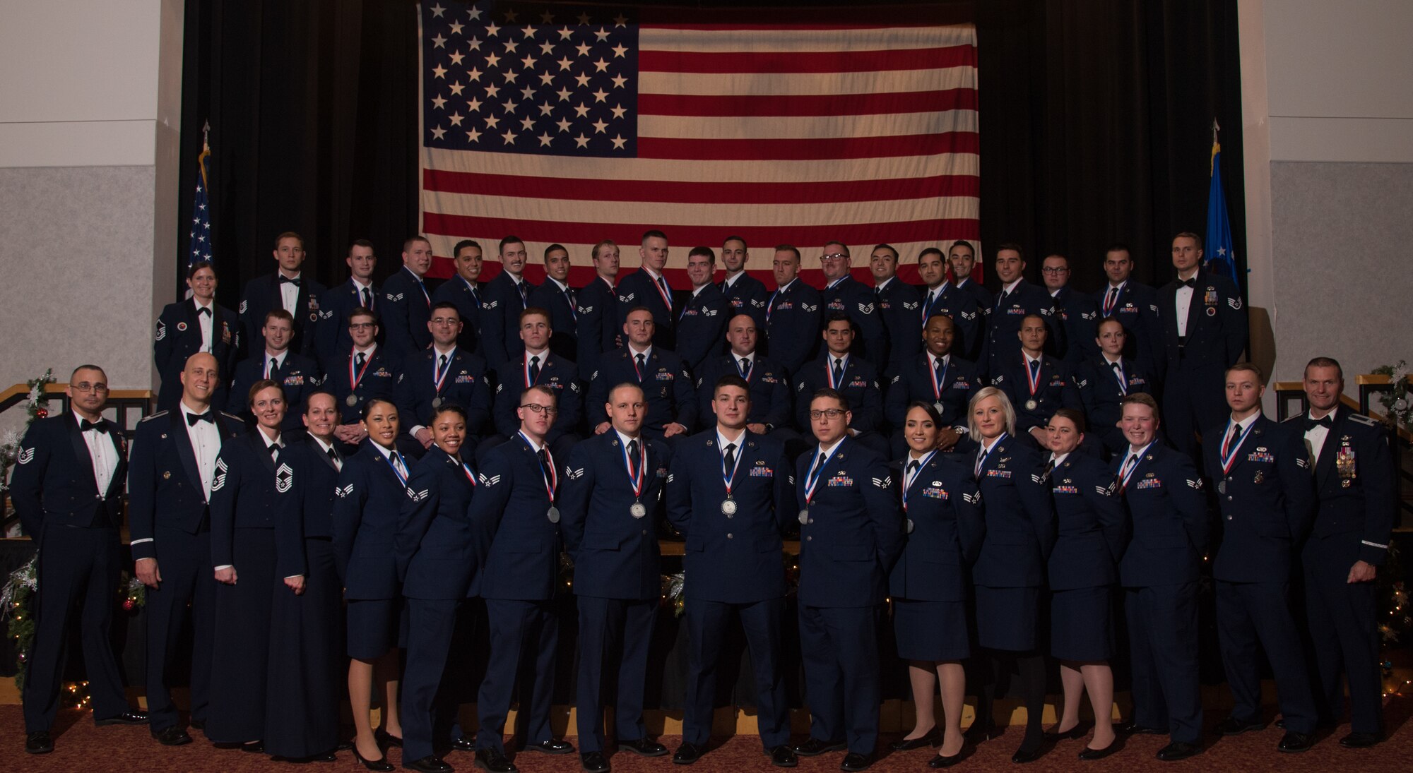 Airman Leadership School Class 19-A poses for a photo Dec. 13, 2018, at McConnell Air Force Base, Kansas. Each graduate was presented with a certificate from Col. Josh Olson, 22nd Air Refueling Wing commander.