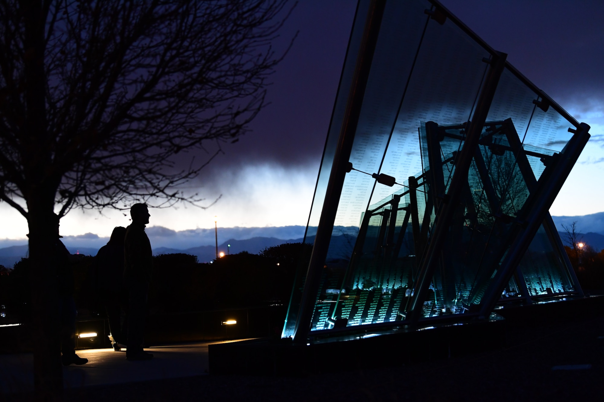 Visitors view over 6,000 names inscribed on the Colorado Freedom Memorial wall in Aurora, Colorado, Dec. 1, 2018.