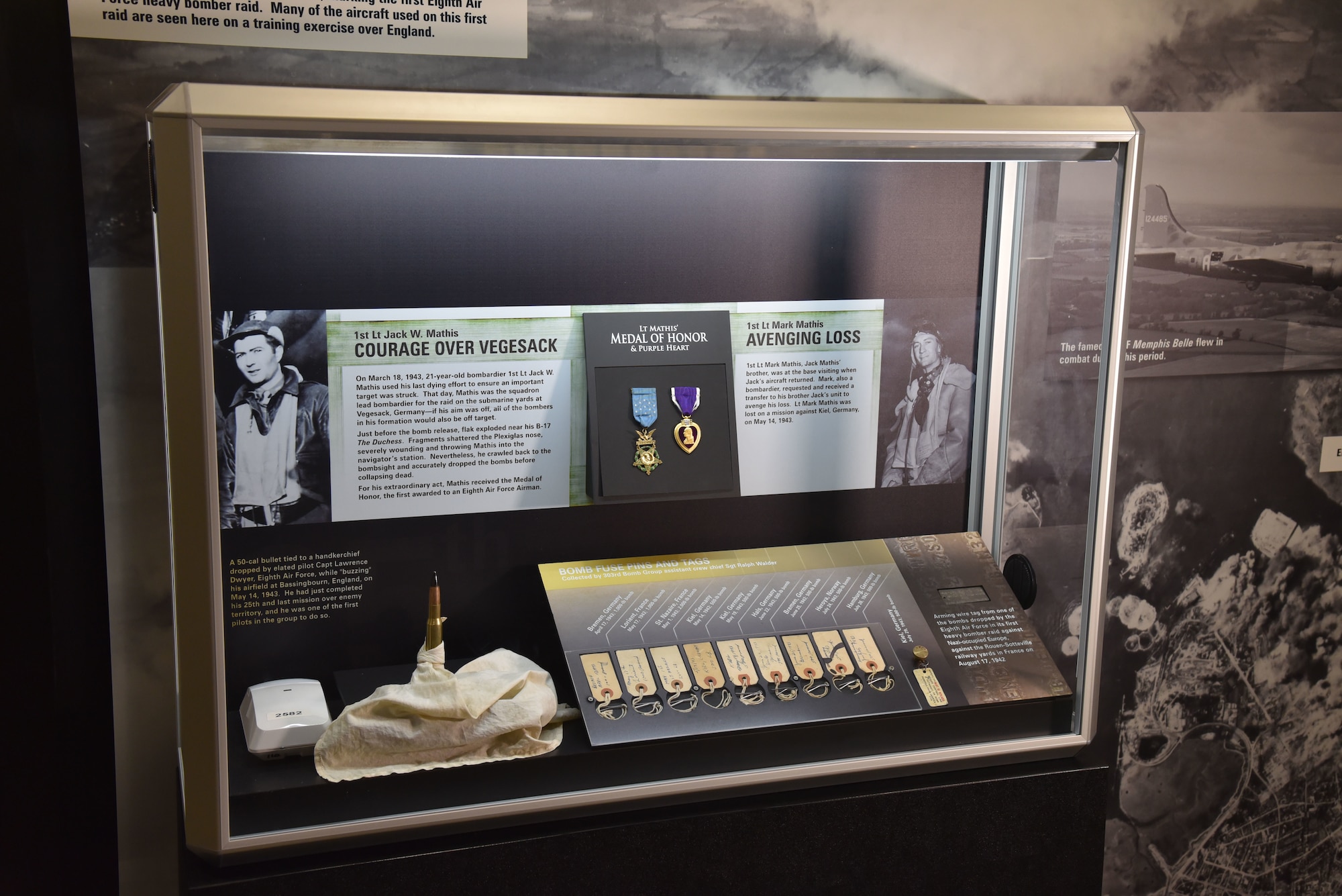 Arming wire tag, bomb fuse pins, 50-cal bullet, and more on display as part of the Early Operations: Eighth Air Force in England exhibit case in the WWII Gallery at the National Museum of the USAF.(U.S. Air Force photo)