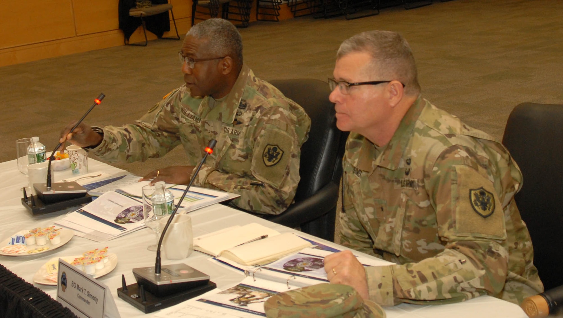 DLA Director Army Lt. Gen. Darrell K. Williams (left) and DLA Troop Support Commander Brig. Gen. Mark Simerly (right) listen as Troop Support senior leaders discuss key topics during a Dynamic Operating Plan review meeting at DLA Troop Support in Philadelphia Dec. 7, 2018.