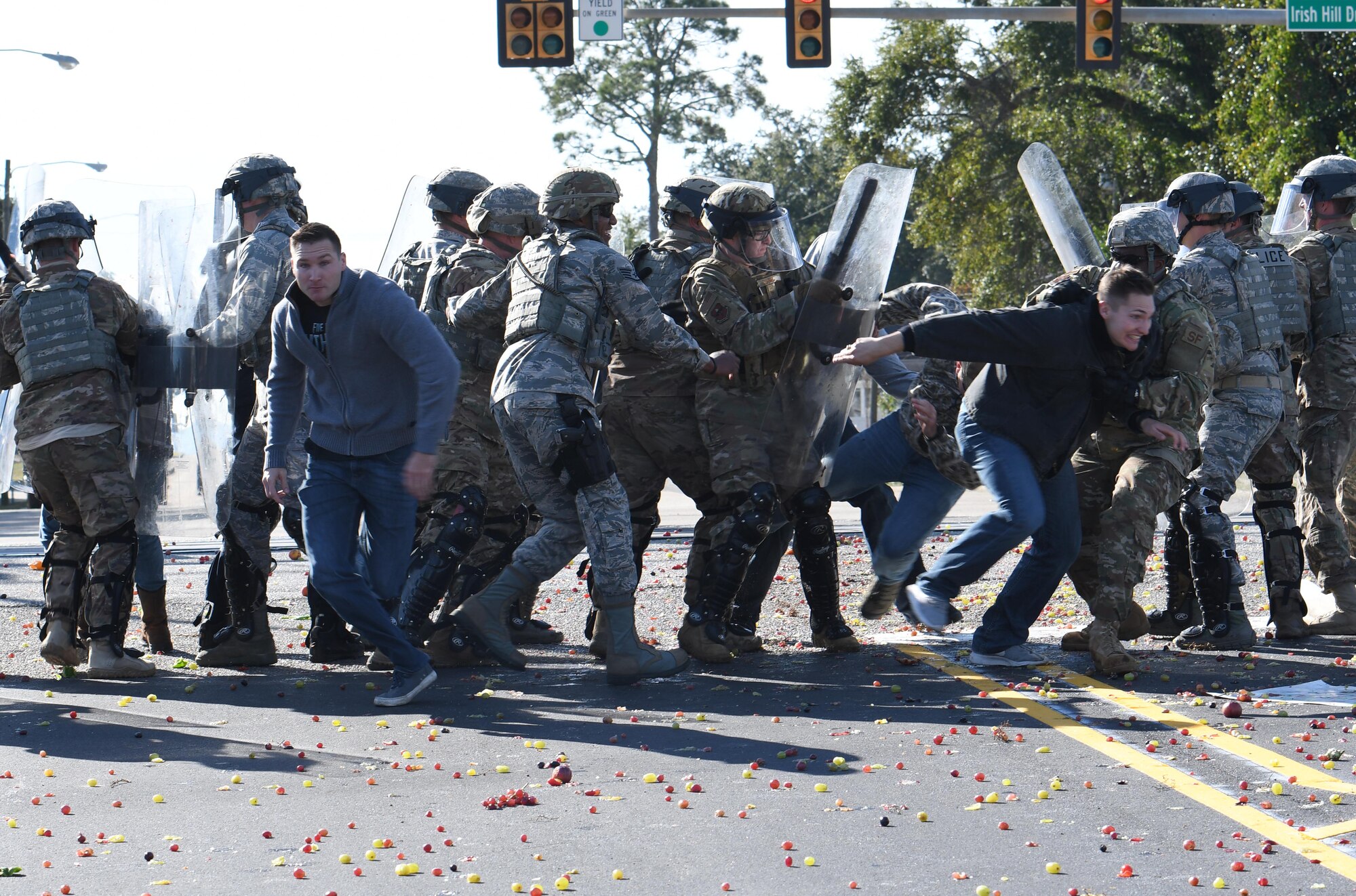 Members of the 81st Security Forces Squadron riot control team apprehend protestors during the 81st Security Forces Squadron protest drill at Keesler Air Force Base, Mississippi, Dec. 12, 2018. The scenario included peaceful protestors expressing their first amendment right that further escalated to a riot when they felt they weren't being heard. The drill, which was a joint effort with the Biloxi Police Department, was conducted to control or prohibit demonstrations and protests. (U.S. Air Force photo by Kemberly Groue)