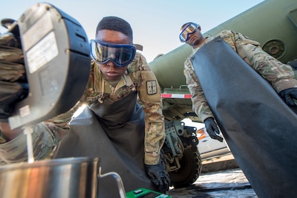 Army Sgt. Leroy Faulkner, a fuel supply specialist from Ft. Lee, Va., tests fuel to determine the amount of additives needed in order for it to reach military specification during a technical demonstration of the Expeditionary Mobile Fuel Additization Capability at the Charleston Defense Fuel Supply Point Dec. 6, 2018.