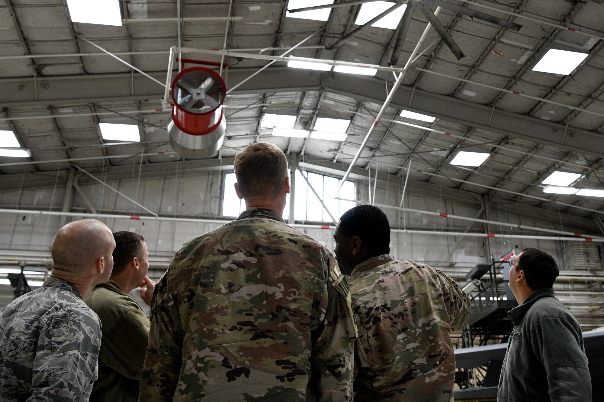 Col. Dee Jay Katzer, Air Combat Command chief of civil engineer division (center), observes newly installed LED lights Dec. 12, 2018, at Seymour Johnson Air Force Base, North Carolina.