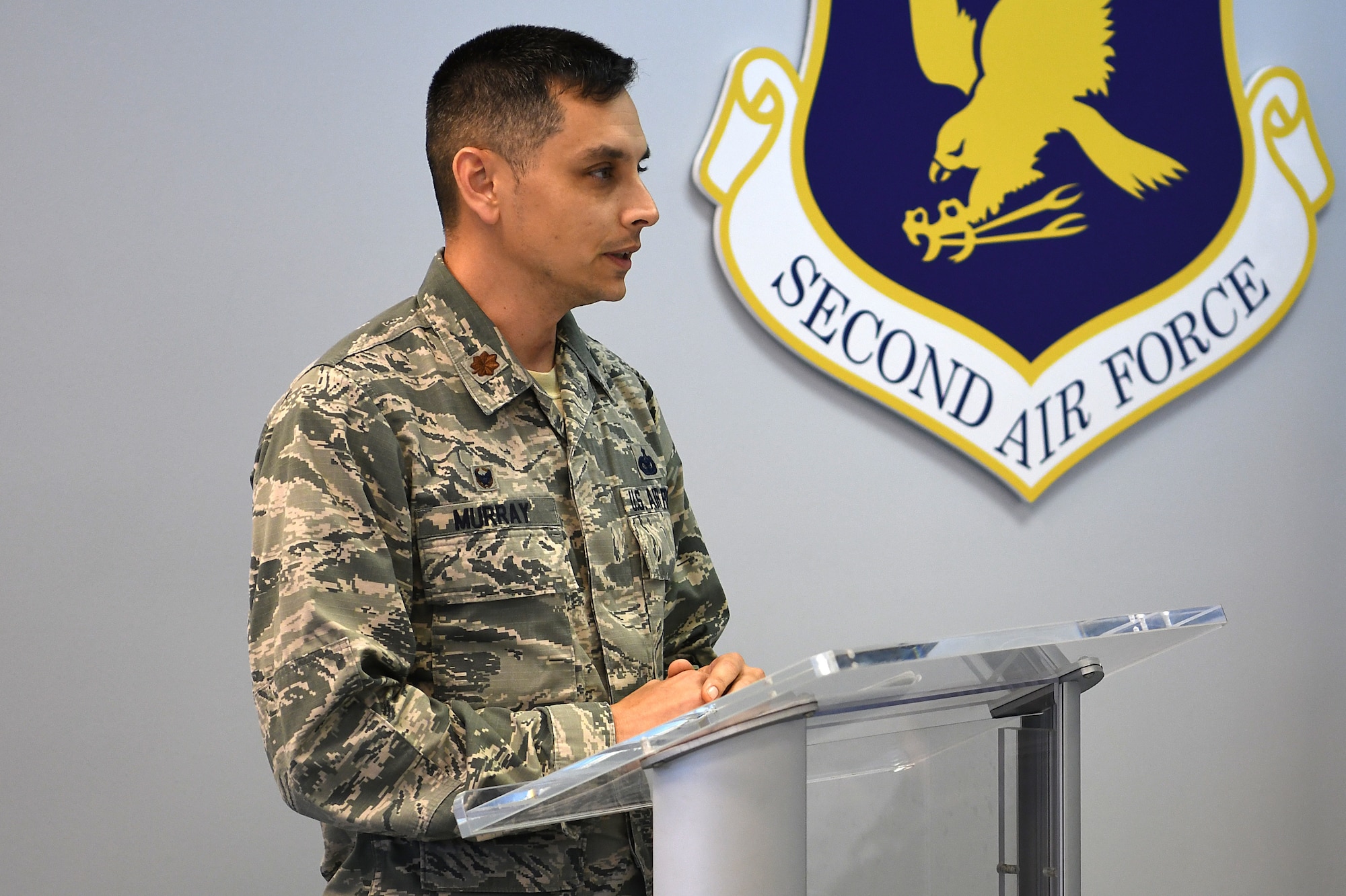 U.S. Air Force Maj. Jonathon Murray, 81st Security Forces Squadron commander, delivers remarks during a retirement ceremony for Bleck, 81st SFS military working dog, inside the Larcher Chapel at Keesler Air Force Base, Mississippi, Dec. 13, 2018. Bleck served eight years and has worked alongside 11 handlers during his career. (U.S. Air Force photo by Airman 1st Class Suzie Plotnikov)