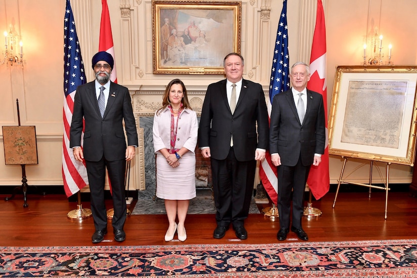 Canadian Minister of Defense Harjit Sajjan, Canadian Minister of Foreign Affairs Chrystia Freeland, Secretary of State Michael R. Pompeo and Defense Secretary James N. Mattis stand for a photo.