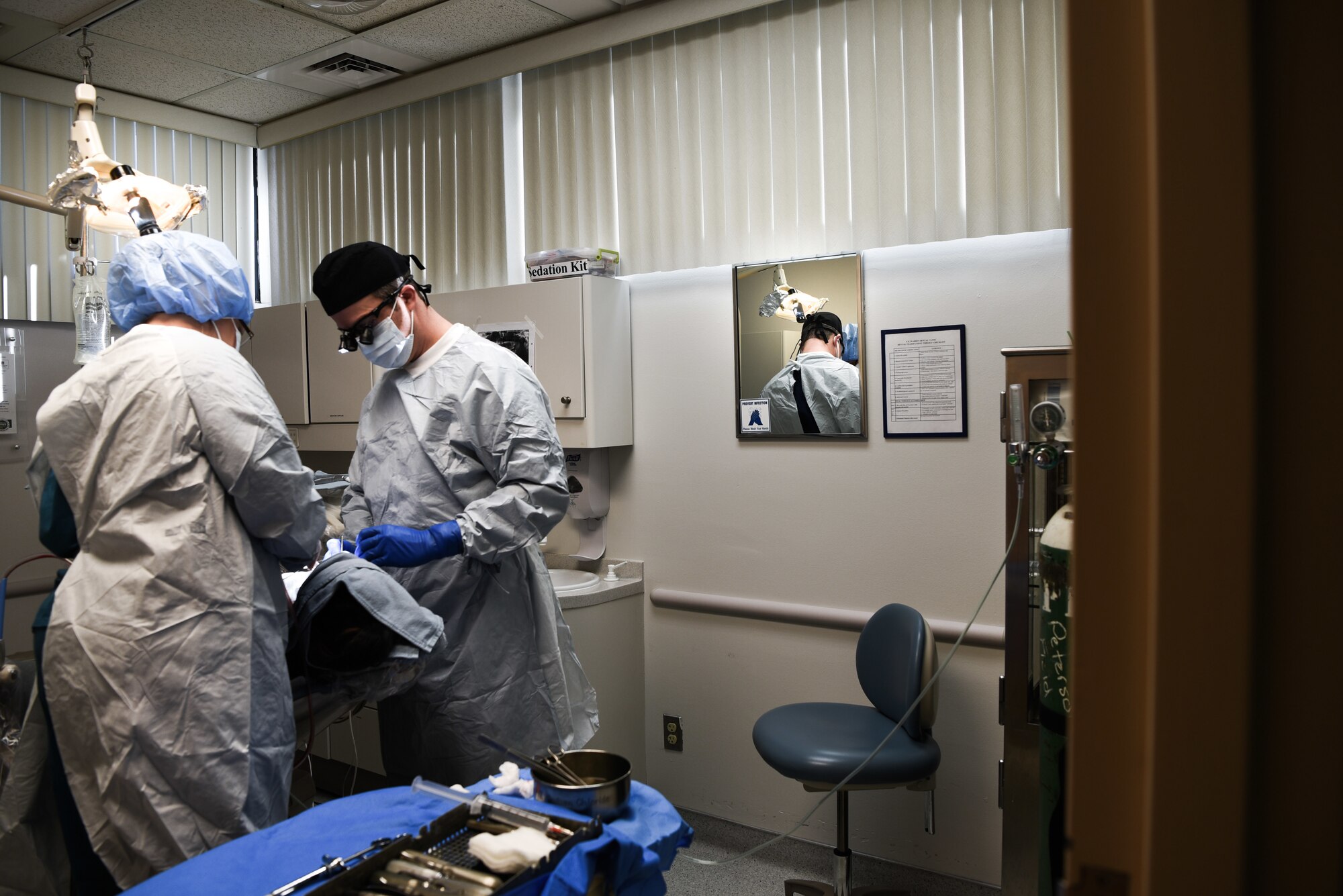 A 90th Medical Group dentist and technician preforms oral surgery on an Airman Jan. 16, 2018, on F.E. Warren Air Force Base, Wyo. The medical clinic recently won several awards from Air Force Global Strike Command, including Small Dental Clinic of the Year for the third time.