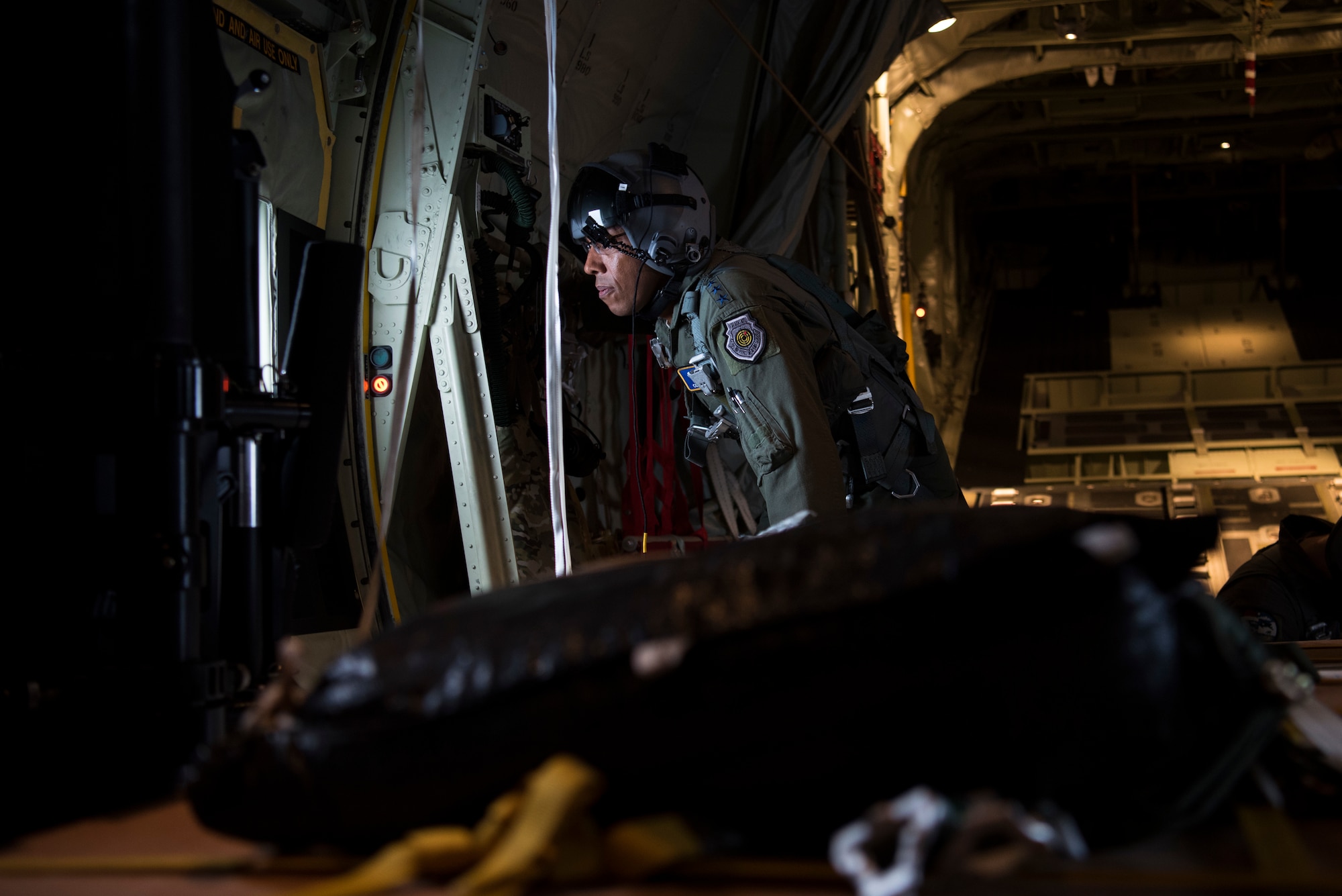 Gen. CQ Brown, Jr., Pacific Air Forces commander, flies on a C-130J, assigned to the 374th Airlift Wing, on a mission supporting Operation Christmas Drop 2018 during a visit to Andersen Air Force Base, Guam, Dec. 11, 2018. Brown visited to better understand the 36th Wing’s mission and role in promoting peace and stability throughout the Indo-Pacific region. (U.S. Air Force photo by Senior Airman Zachary Bumpus)