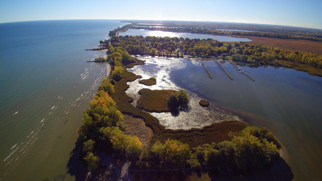 Two years ago, the U.S. Army Corps of Engineers, Buffalo District began a $10 million project to restore the Braddock Bay ecosystem in Greece, NY. Erosion had washed away emergent wetlands and invasive species dominated the marshes. Today, species-rich native communities blossom with emergent aquatic meadows, and restored beach habitat are visited by a variety of shorebirds including black-bellied plover, Baird’s sandpiper, and the federally endangered piping plover.