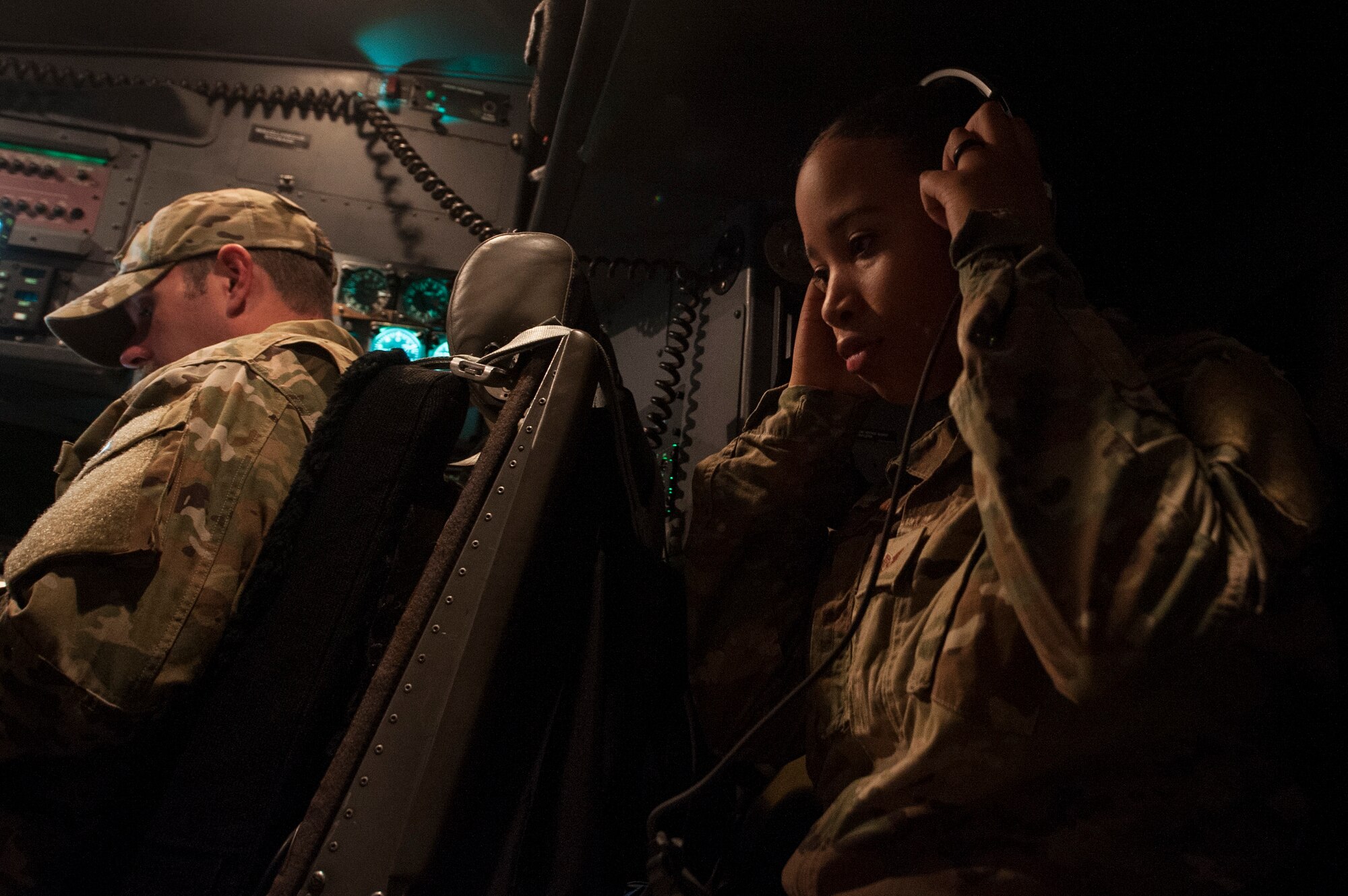 Staff Sgt. Daneasha Jenkins, a 379th Air Expeditionary Wing (AEW) chaplain’s assistant, adjusts her headset on a C-130 Hercules prior to takeoff Dec. 15, 2018, at Al Udeid Air Base, Qatar.