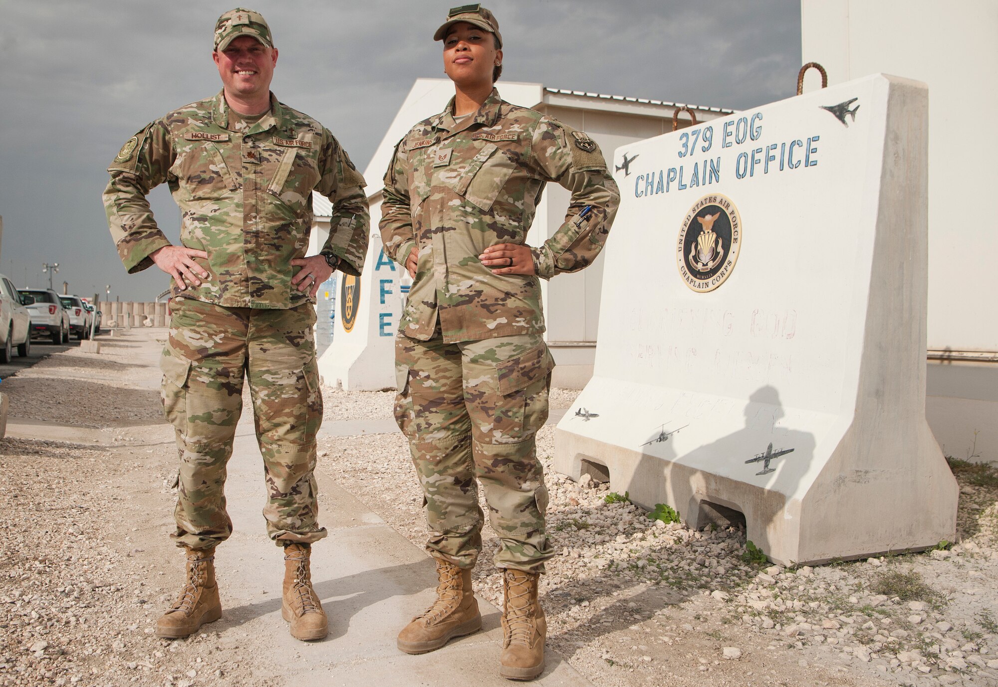 Chaplain (Maj.) Cody Hollist and Staff Sgt. Daneasha Jenkins, of the 379th Air Expeditionary Wing chapel office, stand in front of their 379th EOG chapel Nov. 20, 2018, at Al Udeid Air Base, Qatar.