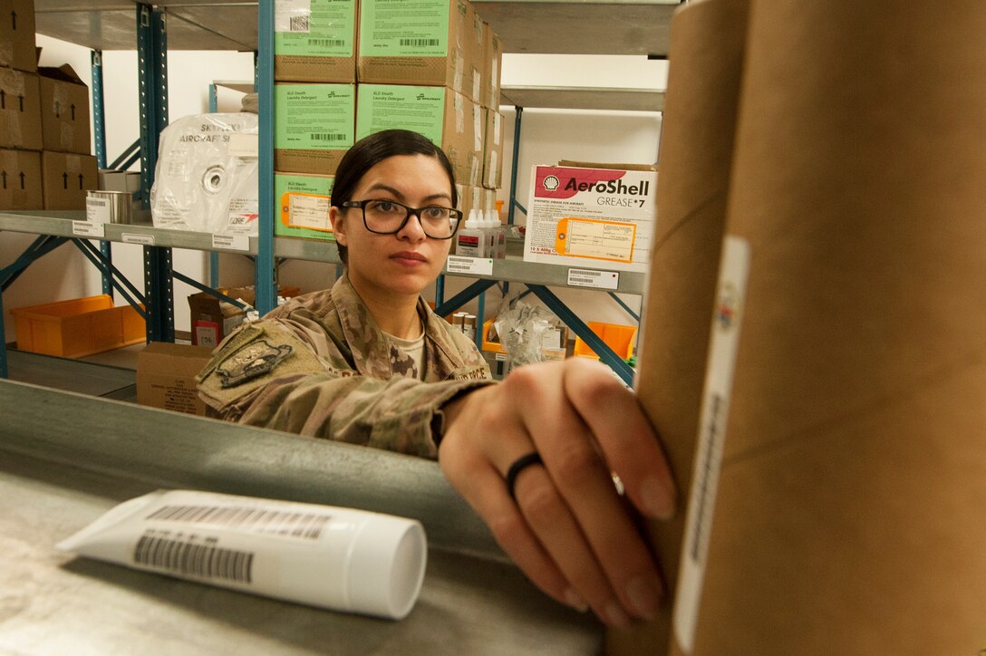 Senior Airman Erica Garcia, 379th Expeditionary Logistics Readiness Squadron hazardous material (HAZMAT) pharmacy technician, conducts inventory at the HAZMAT pharmacy Dec. 13, 2018, at Al Udeid Air Base, Qatar.