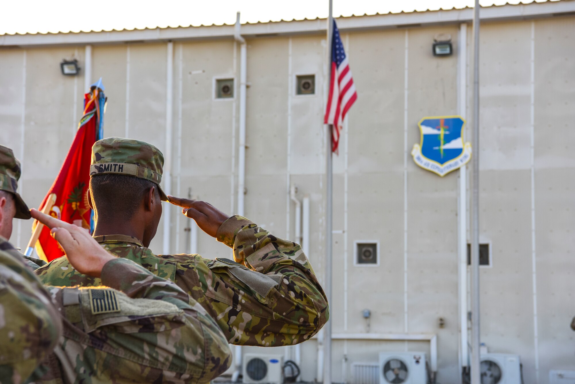Soldiers assigned to the 1st Battalion, 43rd Air Defense Artillery Regiment render a salute during The National Anthem at a monthly retreat ceremony at Al Dhafra Air Base, United Arab Emirates, Dec. 7, 2018.