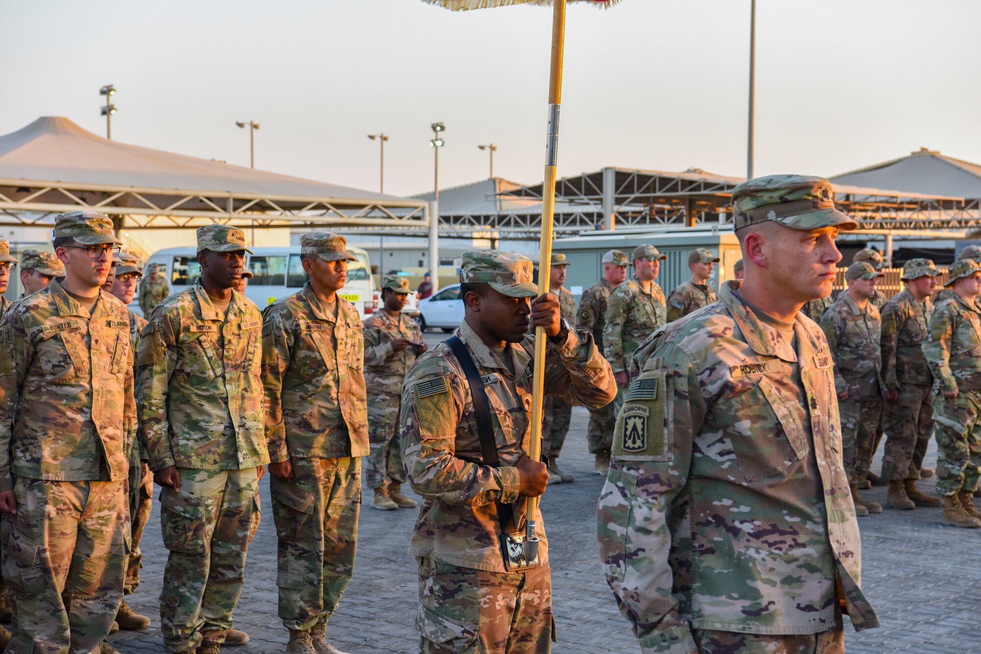 Army LTC Michael R. Rodick, 1st Battalion, 43rd Artillery Regiment Commander, leads his soldiers in formation during a monthly retreat ceremony at Al Dhafra Air Base, United Arab Emirates, Dec. 7, 2018.