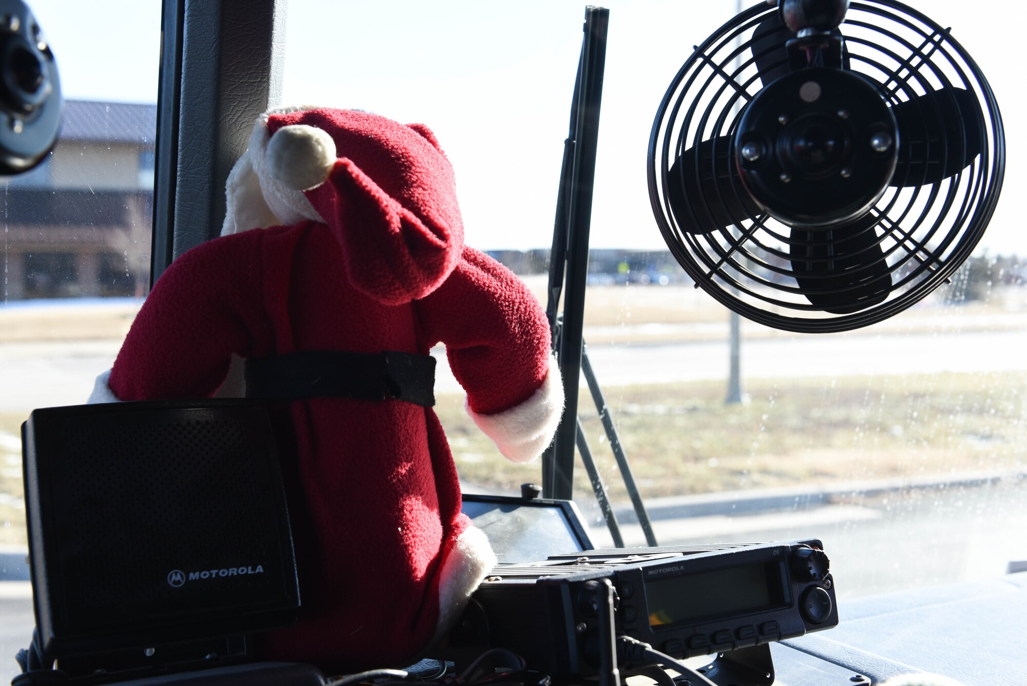 A Santa Claus doll sits in the front window of a fire truck on Ellsworth Air Force Base, S.D., Dec. 13, 2018. Following a “Santa and Me Story Time” event at the Holbrook Library, Airmen and their families were invited to the parking lot to tour a fire truck and visit with firefighters from the 28th Civil Engineer Squadron Fire Department. (U.S. Air Force photo by Airman John Ennis)