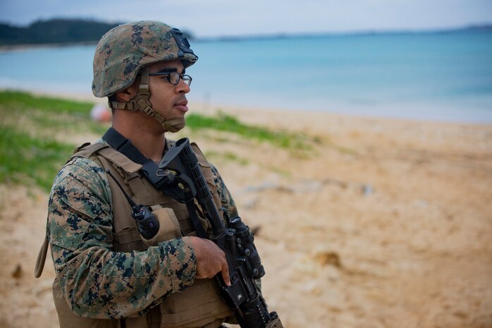 Cpl. Markus Dodd provides security at Kin Blue Training Area, Okinawa, Japan on Dec. 12, 2018 during 3rd Marine Logistics Group Command Post Exercise 19.1. The purpose of MLG CPX 19.1 is to train 3rd MLG's command element, enhance 3rd MLG's warfighting capabilities and to assist the commanding general with maintaining situational awareness while making timely decisions. Dodd, a native of Niles, Michigan, is a machine gunner with Tactical Readiness and Training, G-3, 3rd MLG Headquarters, 3rd MLG. (U.S. Marine Corps photo by Lance Cpl. Terry Wong)