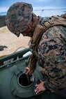 Lance Cpl. Hunter C. Knuckles gauges fuel in a fuel module at Kin Blue Training Area, Okinawa, Japan on Dec. 12, 2018 during 3rd Marine Logistics Group Command Post Exercise 19.1. The purpose of MLG CPX 19.1 is to train the 3rd MLG command element, enhance the unit's warfighting capabilities and to assist the commanding general with maintaining situational awareness while making timely decisions. Knuckles, a native of Bradenton, Florida, is a bulk fuel specialist with Bulk Fuel Company, 9th Engineer Support Battalion, 3rd MLG. (U.S. Marine Corps photo by Lance Cpl. Terry Wong)