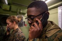 Lance Cpl. Reggie Smallwood (right) and Lance Cpl. Kaytlin Grant conduct radio checks at Kin Blue Training Area, Okinawa, Japan on Dec. 12, 2018 during 3rd Marine Logistics Group's Command Post Exercise 19.1. The purpose of MLG CPX is to train the 3rd MLG's command element, enhance the unit's warfighting capabilities and to assist the commanding general with maintaining situational awareness while making timely decisions. Smallwood and Grant are transmission system operators with Communications Company, Combat Logistics Regiment 37, 3rd Marine Logistics Group. Smallwood is a native of Baltimore, Maryland. Grant is a native of Elberfeld, Indiana. (U.S. Marine Corps photo by Lance Cpl. Terry Wong)