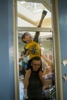 Lance Cpl. Corey J. Hill helps a student clean a window Dec. 14, 2018 at Ginowan, Okinawa, Japan. Marines and Sailors with Combat Logistics Battalion 4, Combat Logistics Regiment 3, 3rd Marine Logistics Group, volunteered at the AmerAsian School in Okinawa to help with various beautification projects around the school. The school conducts triannual clean-up projects before each semester. Hill, a native of Shreveport, Louisiana, is a motor transportation operator with Transportation Service Company, CLB-4, CLR-3, 3rd MLG. (U.S. Marine Corps photo by Lance Cpl. Armando Elizalde)