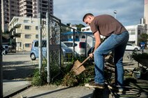 Lance Cpl. Dylan L. Simpson shovels weeds from a flower bed Dec. 14, 2018 at Ginowan City, Okinawa, Japan. Marines and Sailors with Combat Logistics Battalion 4, Combat Logistics Regiment 3, 3rd Marine Logistics Group, volunteered at the AmerAsian School in Okinawa to help with various beautification projects around the school. The school conducts triannual clean-up projects before each semester. Simpson, a native of Winston-Salem, North Carolina, is a landing support specialist with Transportation Service Company, CLB-4, CLR-3, 3rd MLG. (U.S. Marine Corps photo by Lance Cpl. Armando Elizalde)