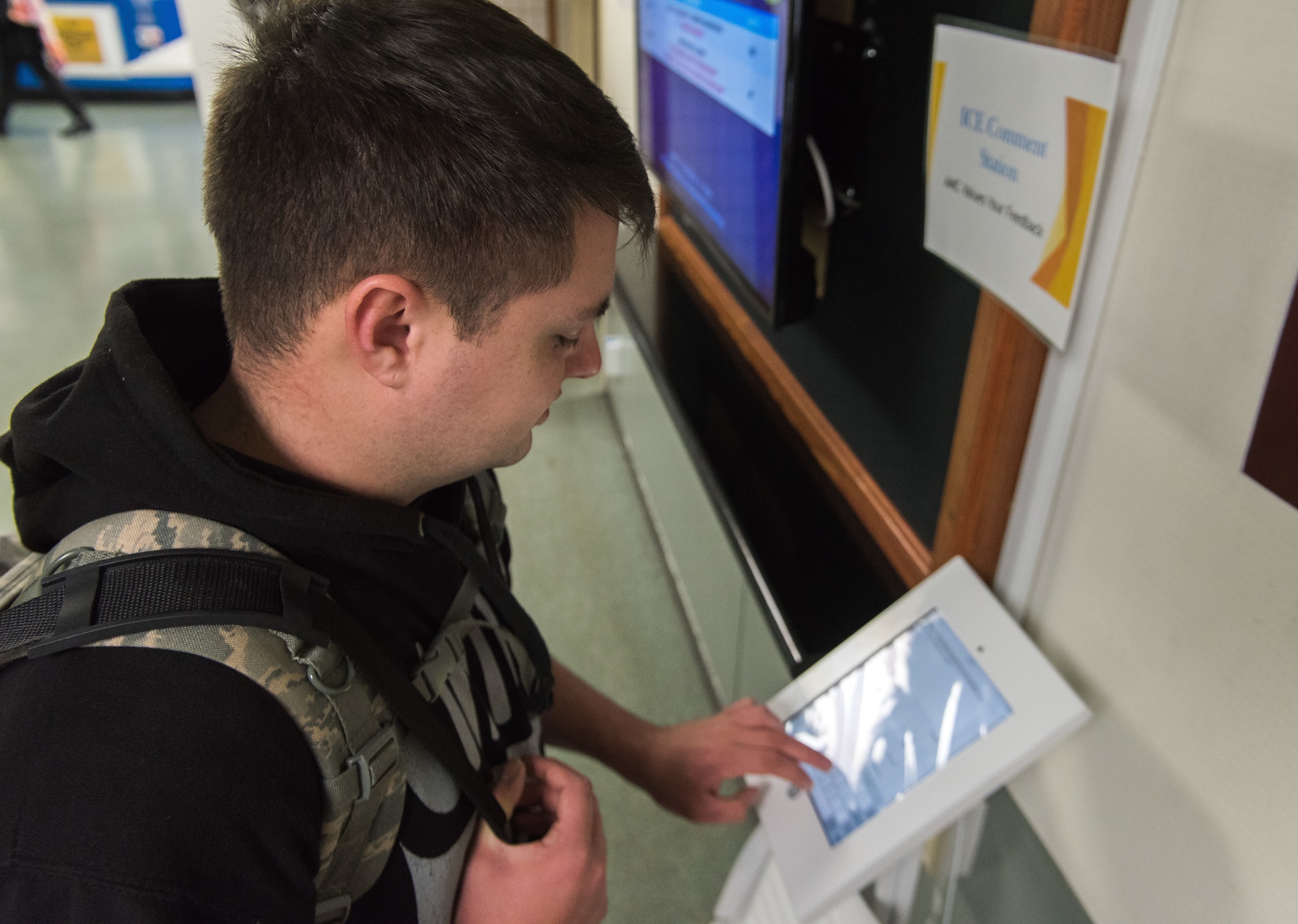 Senior Airman Dylan Jesse-Tomlinson, 374th Logistics Readiness Squadron aircraft parts store technician, fills out an ICE comment survey