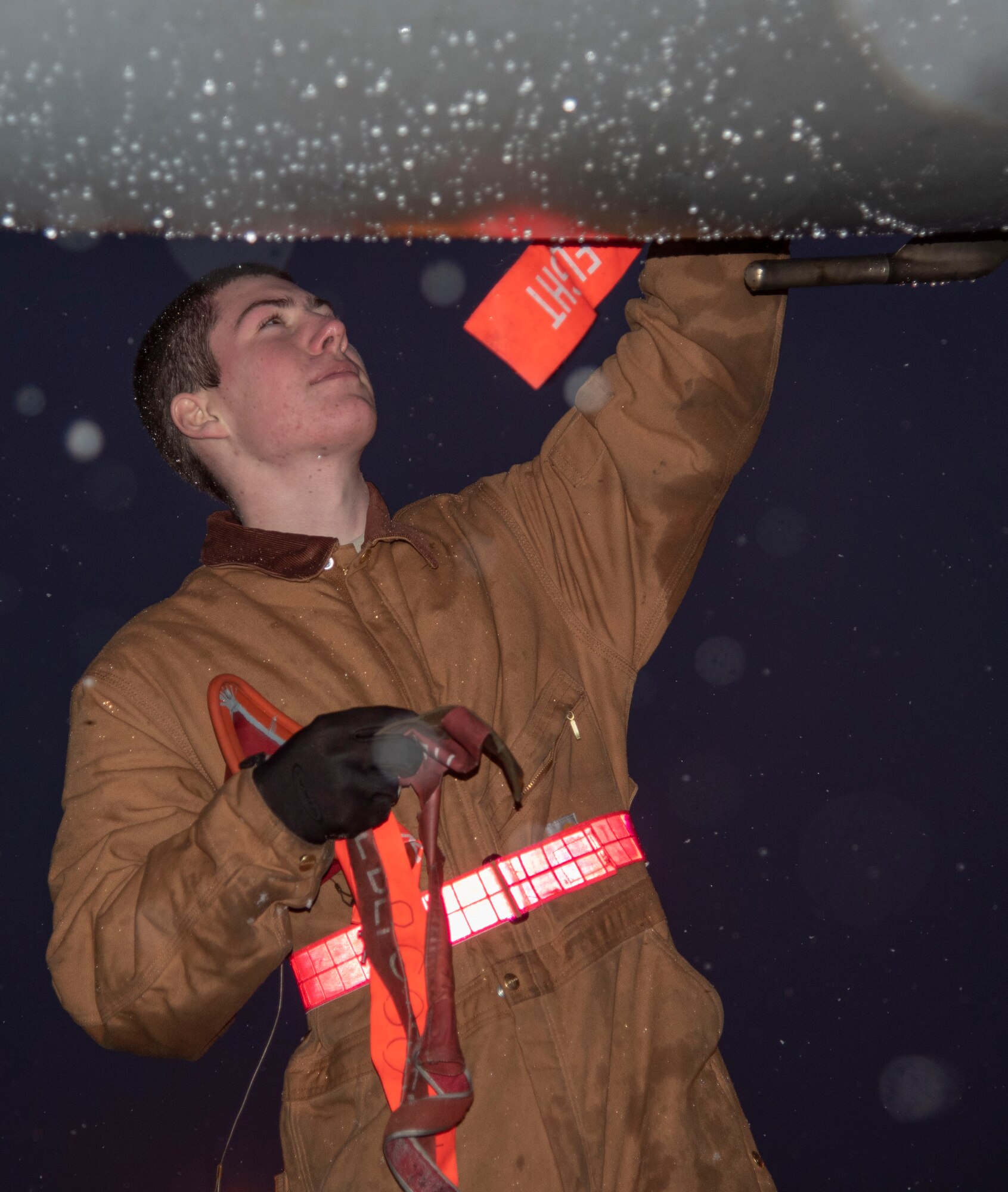 U.S. Air Force Airman 1st Class Avery Fortenbery, a 13th Aircraft Maintenance Unit crew chief, installs a cover on an F-16 Fighting Falcon at Misawa Air Base, Japan, Dec. 11, 2018. Crew chiefs assist Misawa AB’s fighter squadrons by ensuring quality maintenance for the aircraft. (U.S. Air Force photo by Airman 1st Class Genesis Tejada)