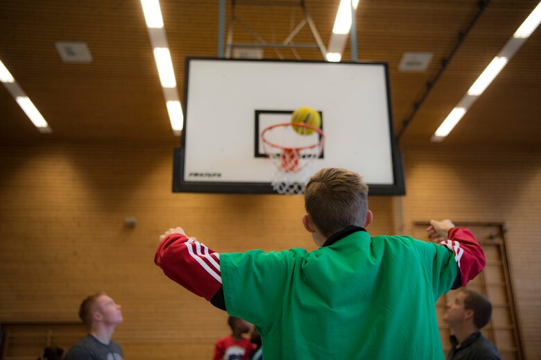 A Kaiserslautern Military Community Special Olympics participant makes a free-throw during the competition held Dec. 7, 2018 at the Polizei Academy in Enkenbach-Alsenborn, Germany. Ten different organizations from Ramstein Air Base hosted this year’s Winter Special Olympics where athletes participated in events such as basketball, hockey, a sprinting drill, and soccer. (U.S. Air Force photo by Airman 1st Class Kristof J. Rixmann)