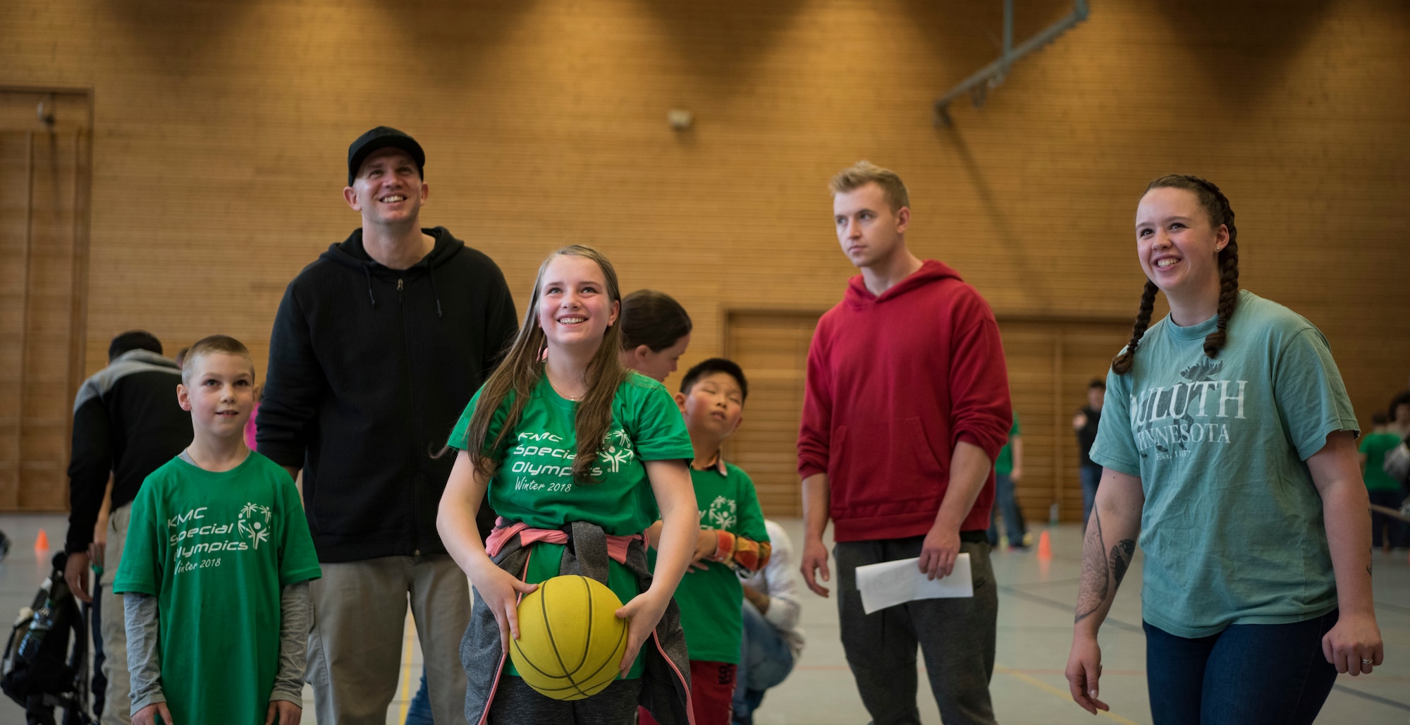 Kaiserslautern Military Community volunteers and Special Olympics participants shoot free-throws during the KMC Special Olympics Winter Event Dec. 7, 2018 at the Polizei Academy in Enkenbach-Alsenborn, Germany. During the event, each athlete was paired with one of approximately 100 KMC volunteers. These volunteers gave their buddies tips and tricks during each event the athlete participated in. These interactions provided fun, laughter, and a sense of connection for both the volunteer and athlete. (U.S. Air Force photo by Airman 1st Class Kristof J. Rixmann)