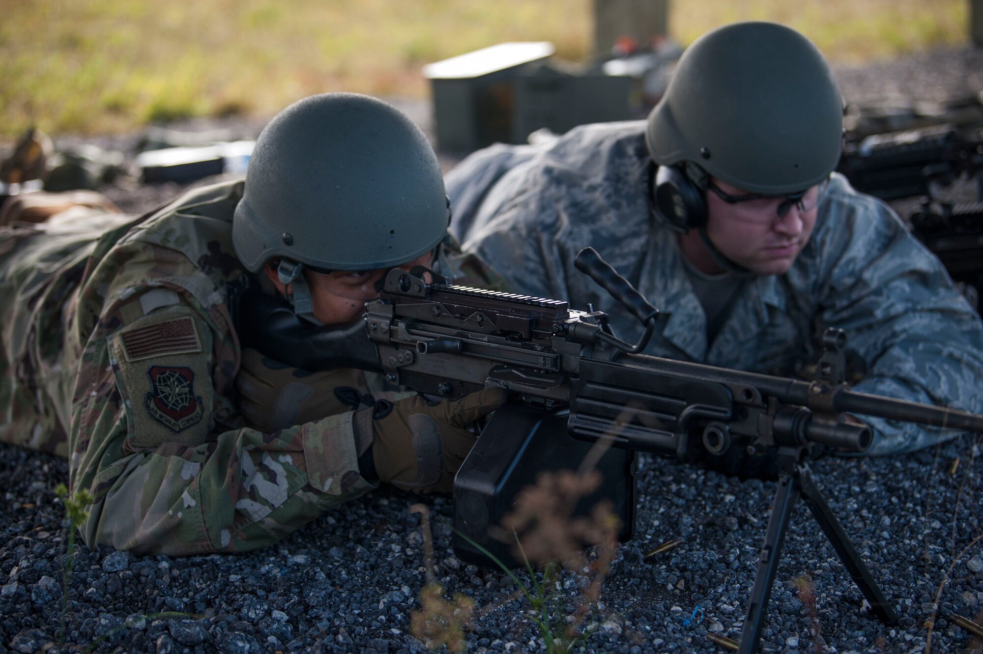 U.S. Air Force Senior Airman Bryan Scott, a 6th Security Forces Squadron marine patrolman, fires the M249 light machine gun while Airman 1st Class Dustin Worell acts as observer during heavy weapons training at Avon Park Air Force Range, Fla., Dec. 12, 2018.