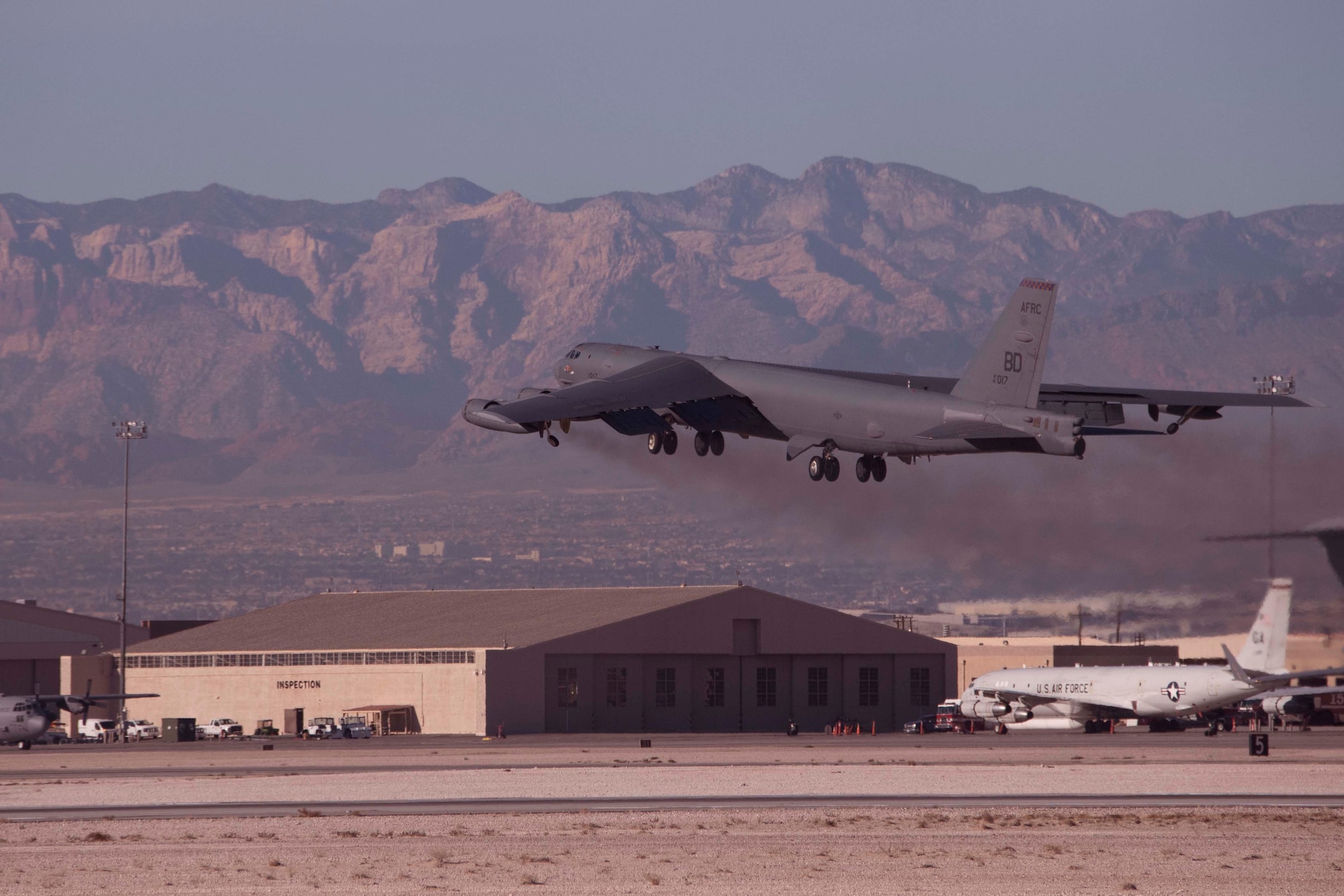 A B-52 Stratofortress with the 340th Weapons Squadron takes off over Nellis Air Force Base, Nevada, Dec. 11, 2018.  Members of the 340th WPS took part in the biannual Weapons School Integration exercise.  They were supported maintainers from the 307th Bomb Wing and 2nd BW from Barksdale Air Force Base, Louisiana.  The maintainers regularly leverage experience and manpower in the total force integration model.   The WSINT provided war time scenarios to enhance maintainer and air crew readiness. (U.S. Air Force photo by Master Sgt. Ted Daigle)