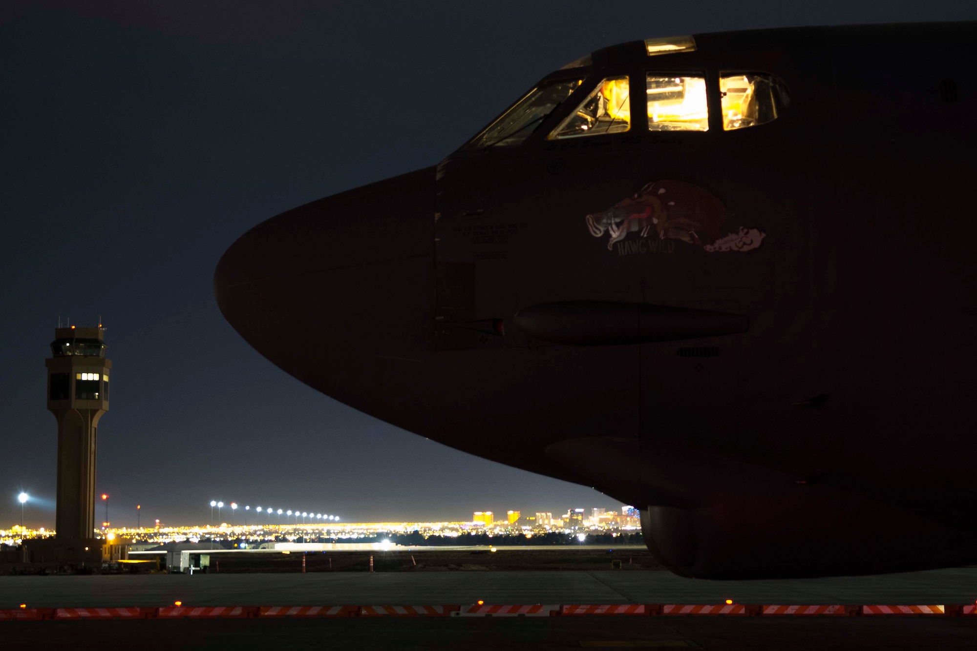 A B-52 Stratofortress undergoes maintenance during the early morning hours of Dec. 12, 2018 at Nellis Air Force Base, Nevada.  Maintainers from the 307th Bomb Wing and 2 BW worked together during the biannual Weapons School Integration exercise to ensure the jets were ready to go.  Although the Airmen regularly work together at Barksdale AFB, the WSINT provided them war time scenarios in which to practice the total force integration model. (U.S. Air Force photo by Master Sgt. Ted Daigle)