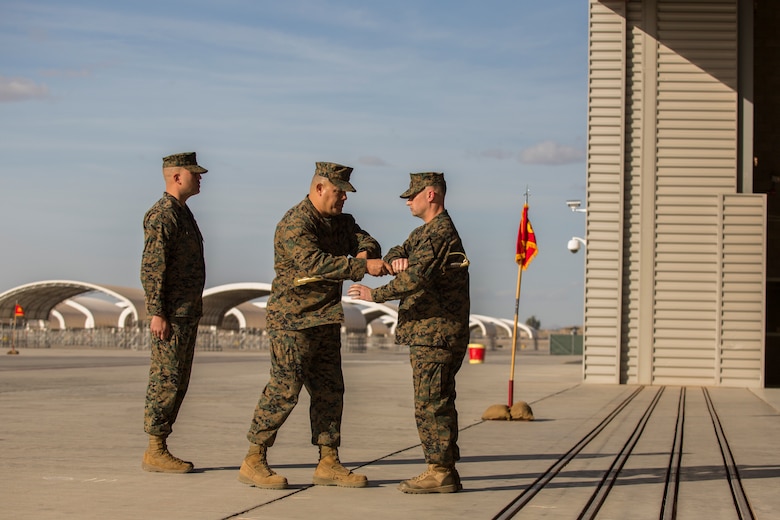 Sgt. Maj. Arturo Cisneros passes the Non-Commissioned Officer sword to the Commanding Officer of Marine Unmanned Aerial Vehicle Squadron one (VMU-1), Lt. Col. Noah Spataro, as a symbol of his relief, Nov. 30, 2018 at the VMU-1 hangar. Sgt. Maj. Cisneros served with VMU-1 honorably for just under three years, ensuring that the Marines assigned to the squadron performed their duties exceptionally while continuously building unit morale. (U.S. Marine Corps photo by Cpl. Sabrina Candiaflores)