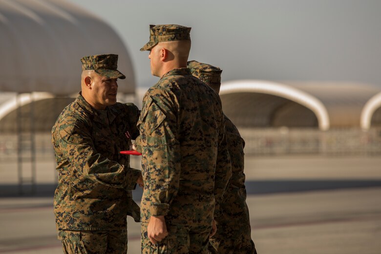 Sgt. Maj. Arturo Cisneros receives his Meritorious Service Medal after being relieved by Sgt. Maj. Jesse Becker, Sergeant Major of Marine Unmanned Aerial Vehicle Squadron one (VMU-1), Nov. 30, 2018 at the VMU-1 hangar. Sgt. Maj. Cisneros served with VMU-1 honorably for just under three years, ensuring that the Marines assigned to the squadron performed their duties exceptionally while continuously building unit morale. (U.S. Marine Corps photo by Cpl. Sabrina Candiaflores)