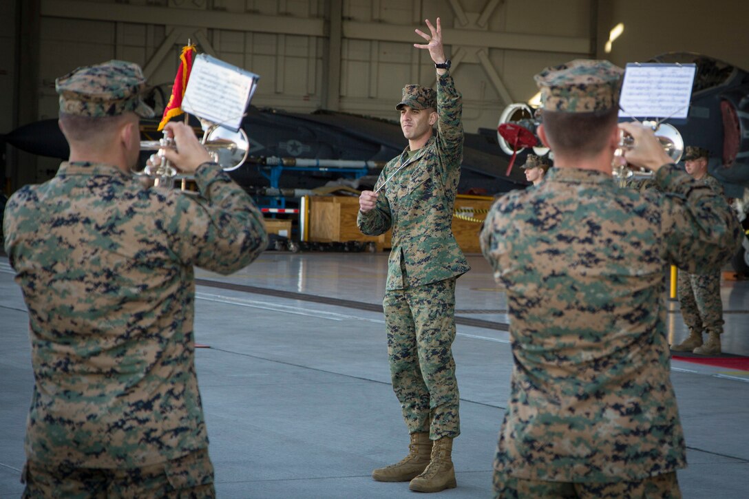 U.S. Marine Corps CWO2 Mark A. Pellon, officer in charge of the Third Marine Aircraft Wing Band, Marine Corps Air Station (MCAS) Miramar, performs during a Change of Command Ceremony where Lt. Col. Michael W. McKenney, commanding officer for VMA-311 relinquished command to Lt. Col. Robb T. McDonald on MCAS Yuma, Ariz., Dec. 13, 2018. The Change of Command Ceremony represents the transfer of responsibility, authority, and accountability from the outgoing commanding officer to the incoming commanding officer. (U.S. Marine Corps photo by Sgt. Allison Lotz)