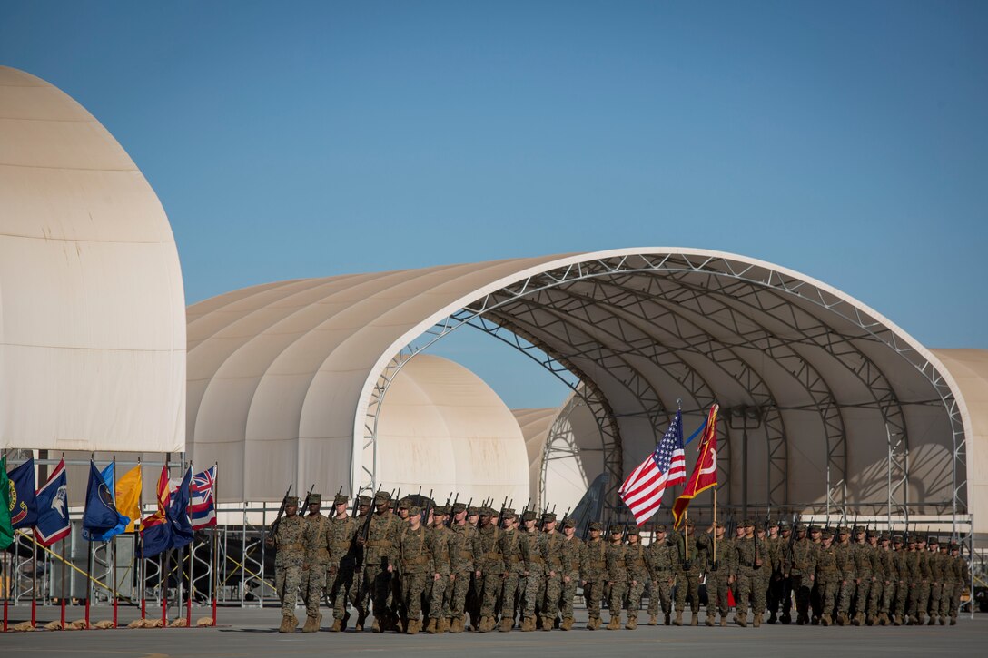 U.S. Marines with Marine Attack Squadron 311 (VMA-311), Marine Corps Air Station (MCAS) Yuma, participate in the Change of Command Ceremony where Lt. Col. Michael W. McKenney, commanding officer for VMA-311 relinquished command to Lt. Col. Robb T. McDonald on MCAS Yuma, Ariz., Dec. 13, 2018. The Change of Command Ceremony represents the transfer of responsibility, authority, and accountability from the outgoing commanding officer to the incoming commanding officer. (U.S. Marine Corps photo by Sgt. Allison Lotz)