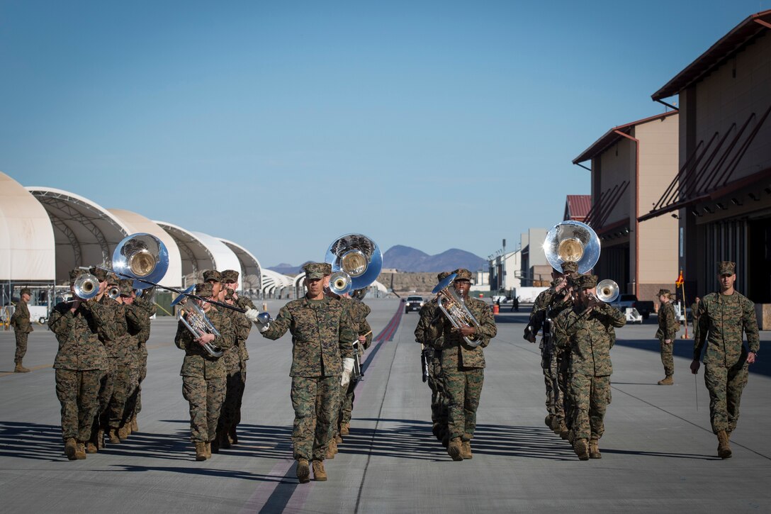 U.S. Marines with the Third Marine Aircraft Wing Band, Marine Corps Air Station (MCAS) Miramar, participate in the Change of Command Ceremony where Lt. Col. Michael W. McKenney, commanding officer for Marine Attack Squadron 311 (VMA-311) relinquished command to Lt. Col. Robb T. McDonald on MCAS Yuma, Ariz., Dec. 13, 2018. The Change of Command Ceremony represents the transfer of responsibility, authority, and accountability from the outgoing commanding officer to the incoming commanding officer. (U.S. Marine Corps photo by Sgt. Allison Lotz)