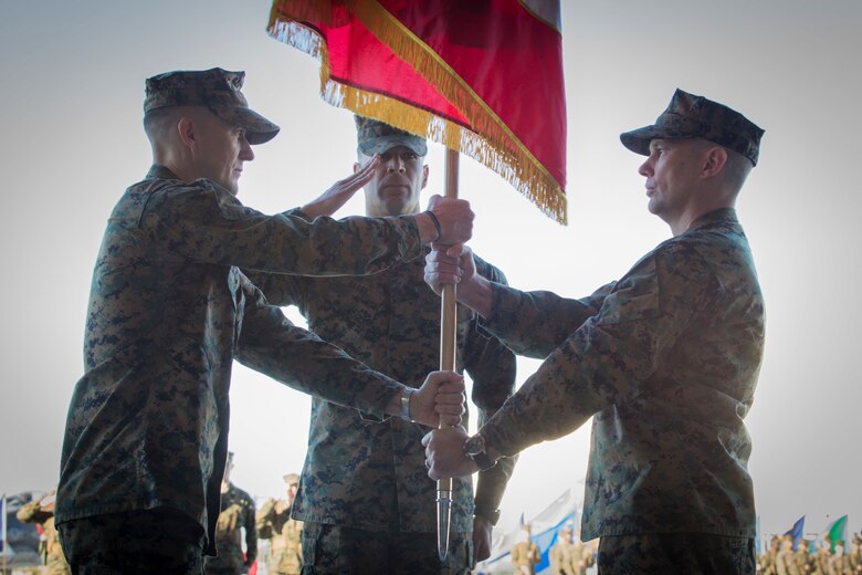 U.S. Marines with Marine Attack Squadron 311 (VMA-311), Marine Corps Air Station (MCAS) Yuma, participate in the Change of Command Ceremony where Lt. Col. Michael W. McKenney, commanding officer for VMA-311 relinquished command to Lt. Col. Robb T. McDonald on MCAS Yuma, Ariz., Dec. 13, 2018. The Change of Command Ceremony represents the transfer of responsibility, authority, and accountability from the outgoing commanding officer to the incoming commanding officer. (U.S. Marine Corps photo by Sgt. Allison Lotz)