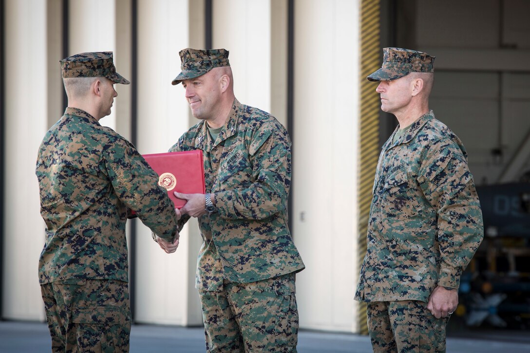 U.S. Marines with Marine Attack Squadron 311 (VMA-311), Marine Corps Air Station (MCAS) Yuma, participate in the Change of Command Ceremony where Lt. Col. Michael W. McKenney, commanding officer for VMA-311 relinquished command to Lt. Col. Robb T. McDonald on MCAS Yuma, Ariz., Dec. 13, 2018. The Change of Command Ceremony represents the transfer of responsibility, authority, and accountability from the outgoing commanding officer to the incoming commanding officer. (U.S. Marine Corps photo by Sgt. Allison Lotz)