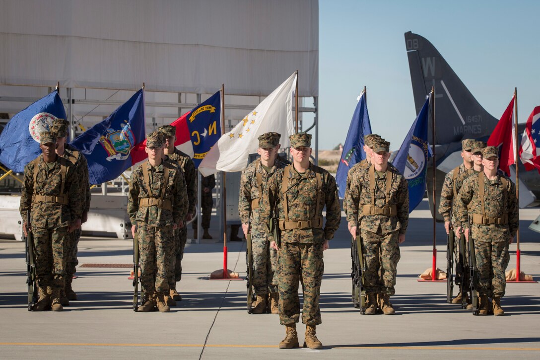 U.S. Marines with Marine Attack Squadron 311 (VMA-311), Marine Corps Air Station (MCAS) Yuma, participate in the Change of Command Ceremony where Lt. Col. Michael W. McKenney, commanding officer for VMA-311 relinquished command to Lt. Col. Robb T. McDonald on MCAS Yuma, Ariz., Dec. 13, 2018. The Change of Command Ceremony represents the transfer of responsibility, authority, and accountability from the outgoing commanding officer to the incoming commanding officer. (U.S. Marine Corps photo by Sgt. Allison Lotz)