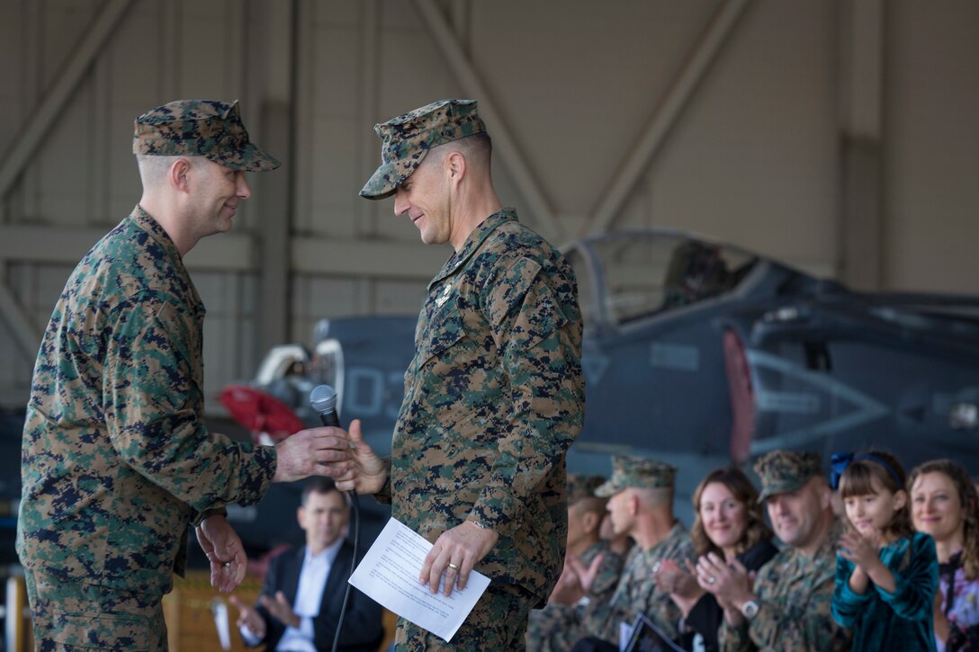 U.S. Marines with Marine Attack Squadron 311 (VMA-311), Marine Corps Air Station (MCAS) Yuma, participate in the Change of Command Ceremony where Lt. Col. Michael W. McKenney, commanding officer for VMA-311 relinquished command to Lt. Col. Robb T. McDonald on MCAS Yuma, Ariz., Dec. 13, 2018. The Change of Command Ceremony represents the transfer of responsibility, authority, and accountability from the outgoing commanding officer to the incoming commanding officer. (U.S. Marine Corps photo by Sgt. Allison Lotz)