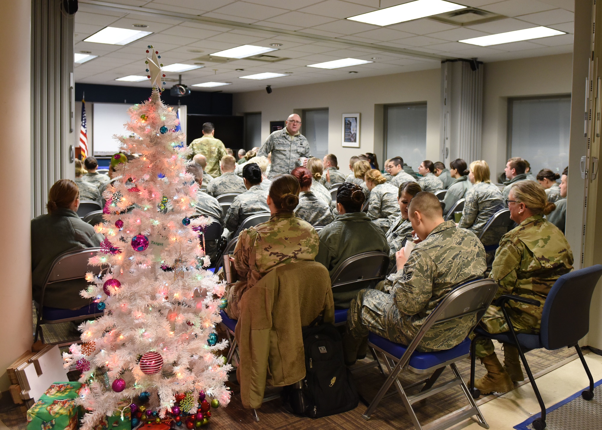 Airmen from the 911th Aeromedical Staging Squadron gather to receive the Commander’s Trophy for the wing intramural sports competition at the Pittsburgh International Airport Air Reserve Station, Pennsylvania, December 2, 2018. Col. Douglas N. Strawbridge, commander of the 911th Airlift Wing, complimented the ASTS Airmen on their camaraderie and their accomplishments in the competition. (U.S. Air Force Photo by Senior Airman Grace Thomson)