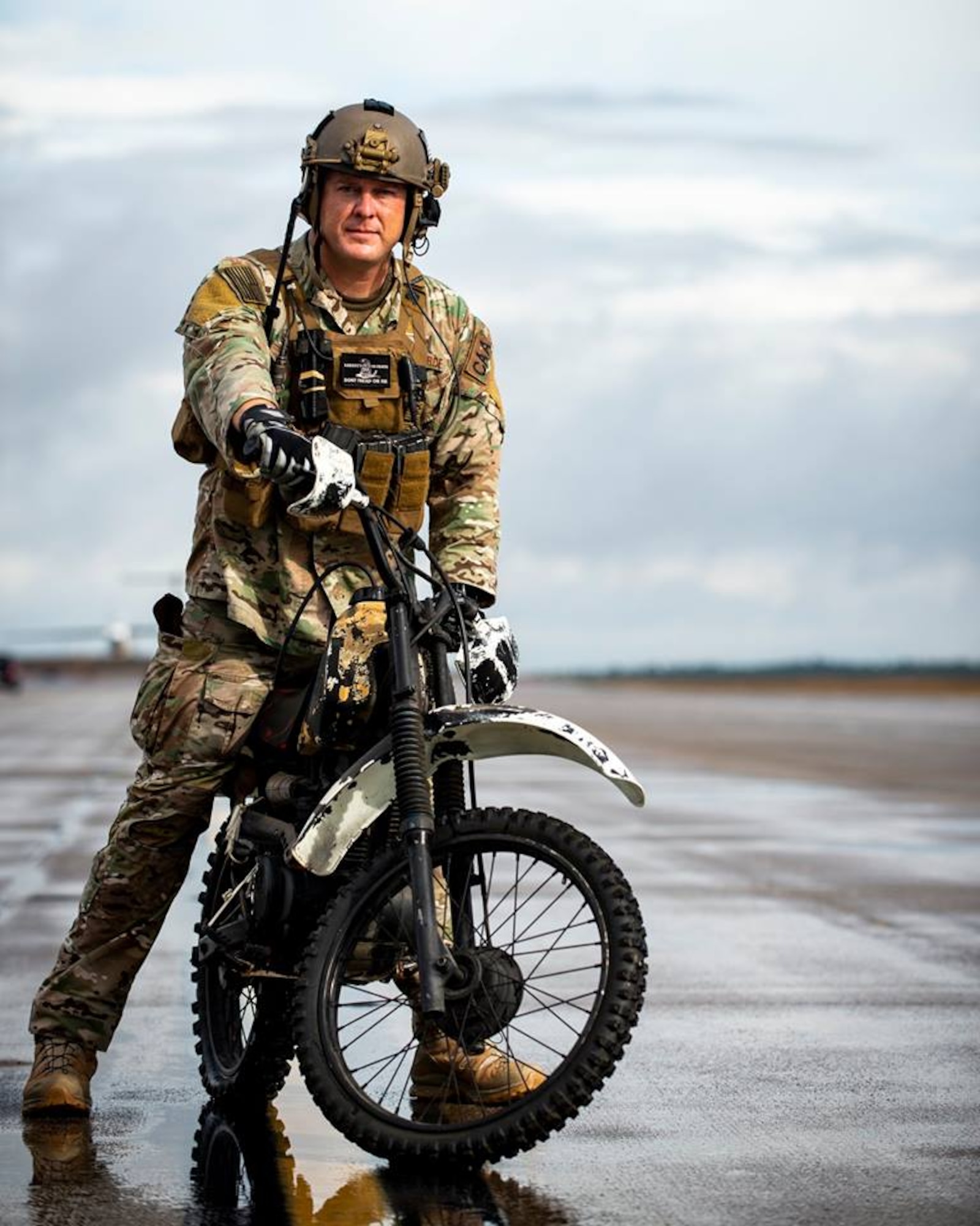 CAA Master Sgt. Joseph Kimbrell prepares to load a motorcycle onto a C-145A