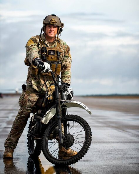 CAA Master Sgt. Joseph Kimbrell prepares to load a motorcycle onto a C-145A