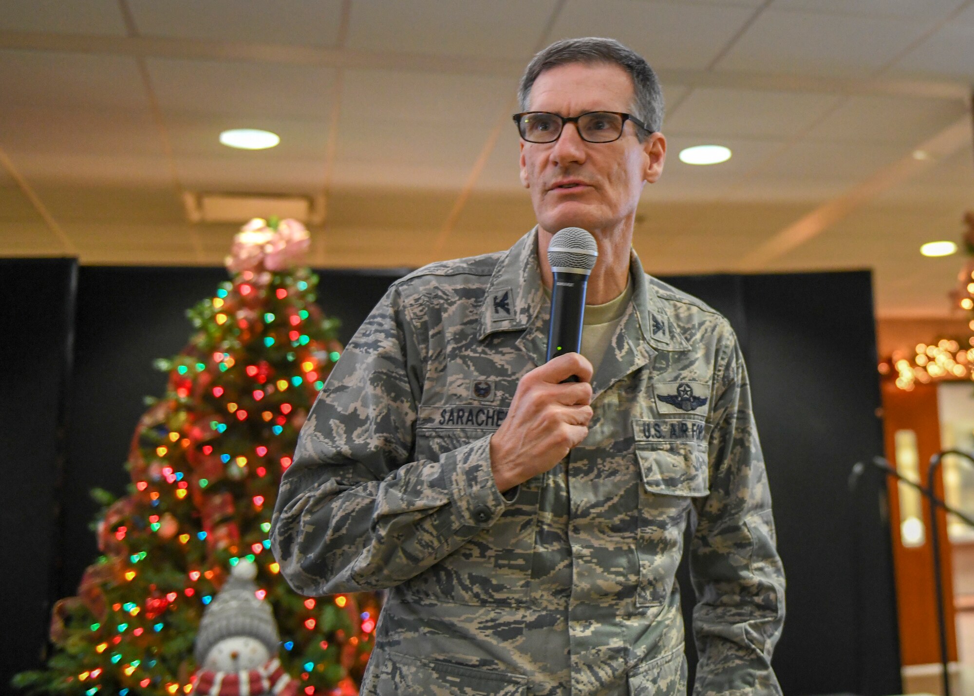 Col. Dan Sarachene, commander of the 910th Airlift Wing, addresses the installation's civilian workforce at a holiday Commander's Call here, Dec. 13, 2012.