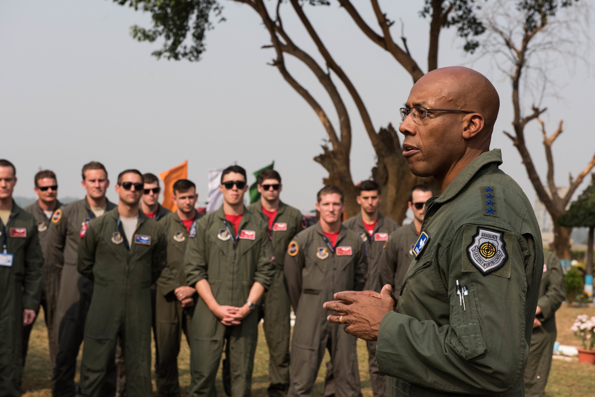 U.S. Air Force Gen. CQ Brown, Jr., Pacific Air Forces commander, speaks with Airmen from Kadena Air Base, Japan, and the Illinois Air National Guard at Cope India 19 at Kalaikunda Air Force Station, India, Dec. 14, 2018