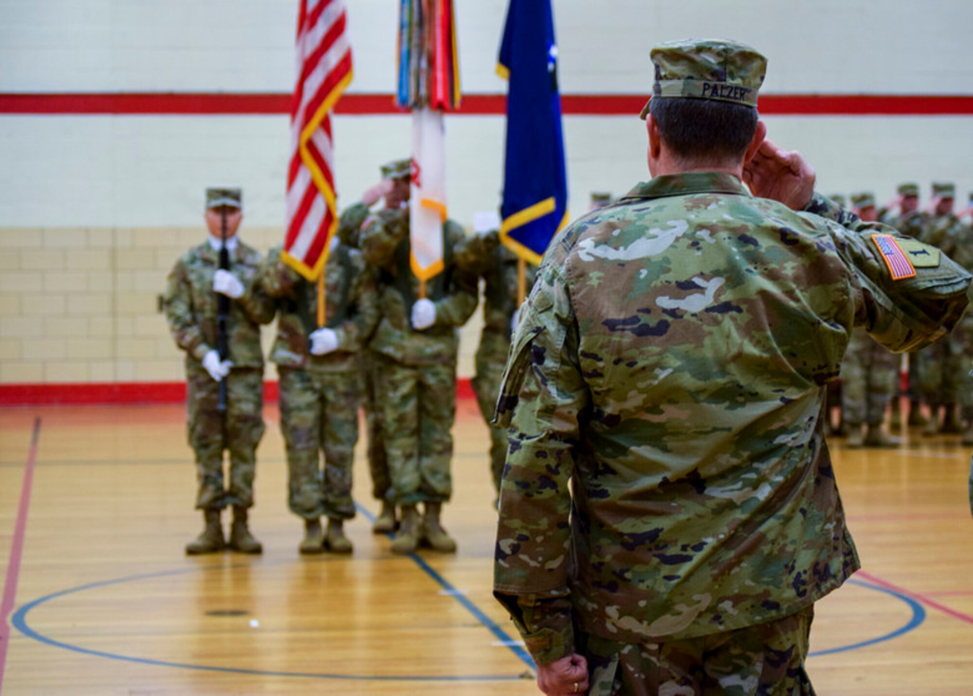 Maj. Gen. Mark W. Palzer, the incoming commanding general salutes during the U.S. Army Reserve 99th Readiness Division change of command ceremony, Dec. 16 at Doughboy Gym, on Joint Base McGuire-Dix-Lakehurst, New Jersey. As commanding general of the 99th DIV(R), Palzer is responsible for administrative, logistics and facilities support to more than 42,000 U.S. Army Reserve Soldiers across a region spanning the thirteen northeastern states. He also serves as the senior commander of Army Support Activity-Fort Dix and U.S. Army Base Fort Devens Training Facilities and Training Support in Massachusetts.