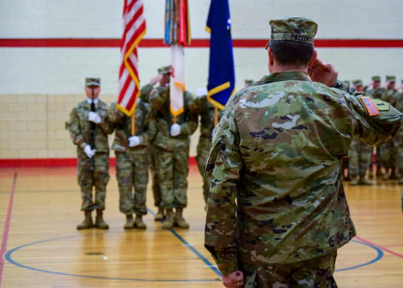 Maj. Gen. Mark W. Palzer, the incoming commanding general salutes during the U.S. Army Reserve 99th Readiness Division change of command ceremony, Dec. 16 at Doughboy Gym, on Joint Base McGuire-Dix-Lakehurst, New Jersey. As commanding general of the 99th DIV(R), Palzer is responsible for administrative, logistics and facilities support to more than 42,000 U.S. Army Reserve Soldiers across a region spanning the thirteen northeastern states. He also serves as the senior commander of Army Support Activity-Fort Dix and U.S. Army Base Fort Devens Training Facilities and Training Support in Massachusetts.