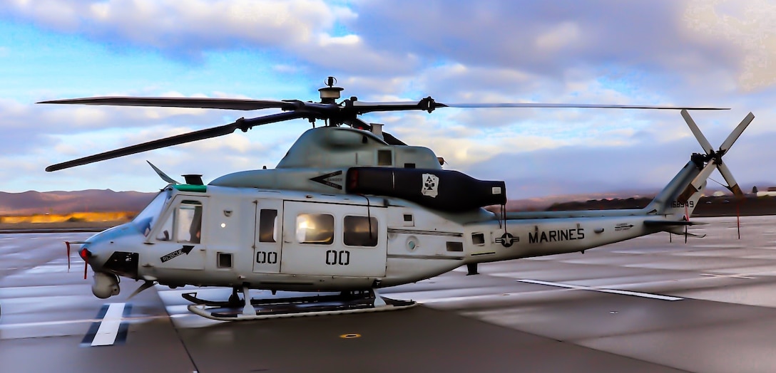 The official helicopter of the Commanding Officer of Marine Light Attack helicopter Squadron 267 stands ready to fly.
*Note: This photo has a light altering filter for clarity. It in no way alters the details of what is happening in or the objects in the photo.