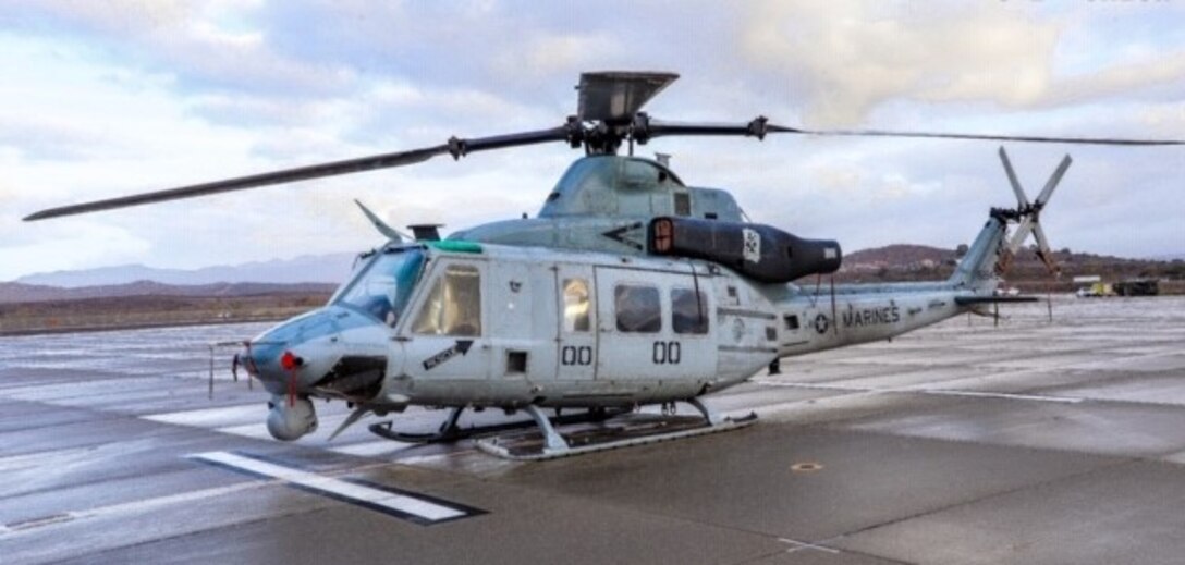 The official helicopter of the Commanding Officer of Marine Light Attack helicopter Squadron 267 stands ready to fly.
*Note: This photo has a light altering filter for clarity. It in no way alters the details of what is happening in or the objects in the photo.